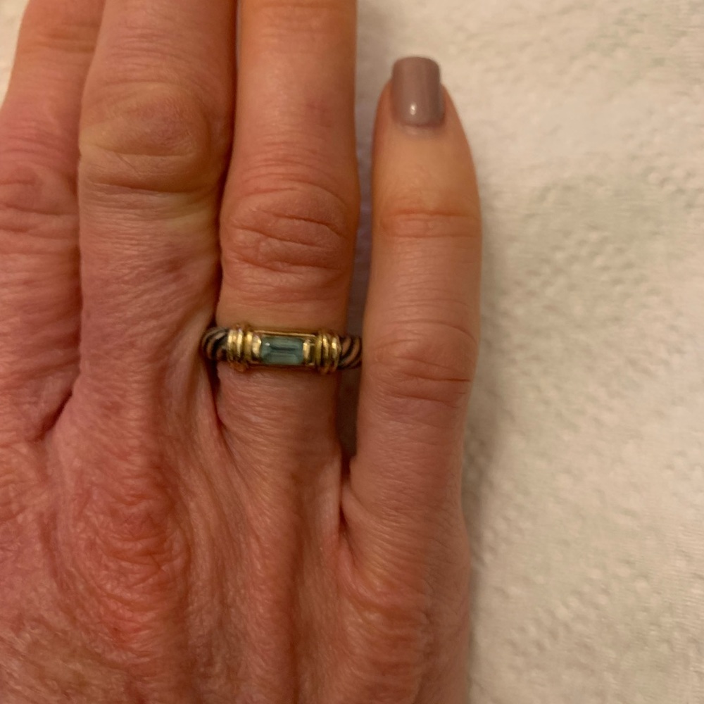 Authentic David Yurman sterling silver and gold trim ring with blue topaz stone.